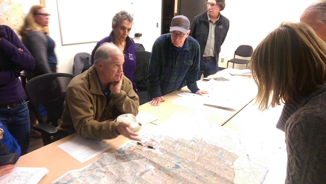 Board member John Griffiths (Center) meeting with an advisory committee. Each committee has a board of directors liaison.