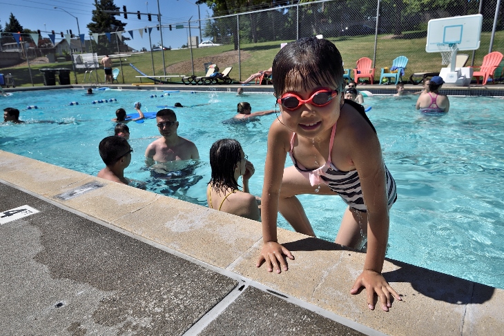 Children and adults cool off in the 25-yard pool at Somerset Swim Center.